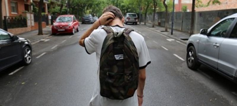 Boy walking in the road