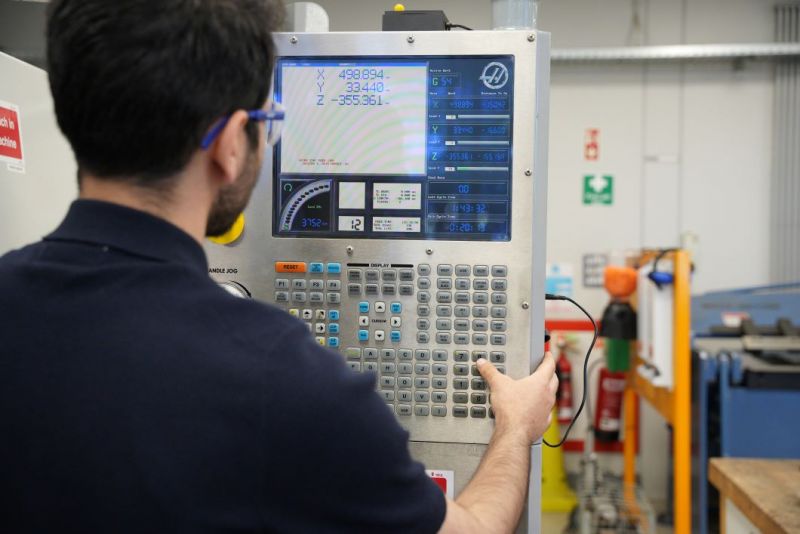 Operator at metal cutting machinery 