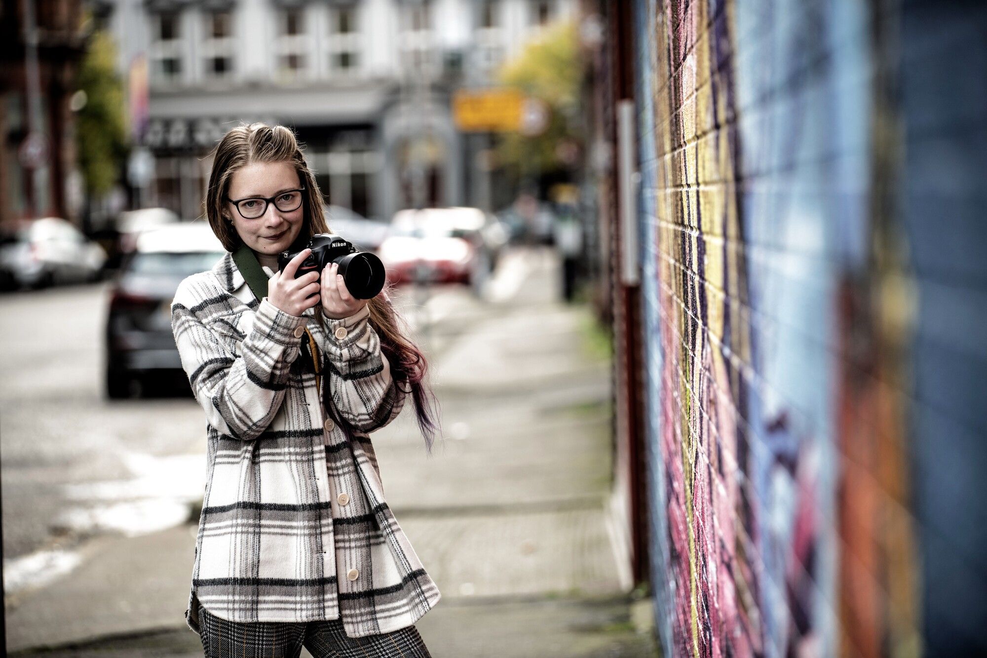 Student with camera photographic street art