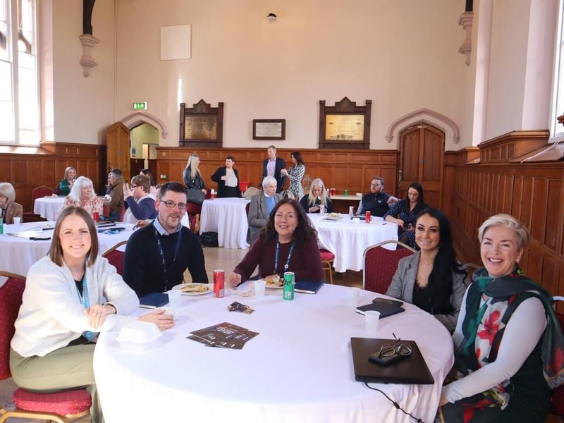 event attendees sitting at roundtable