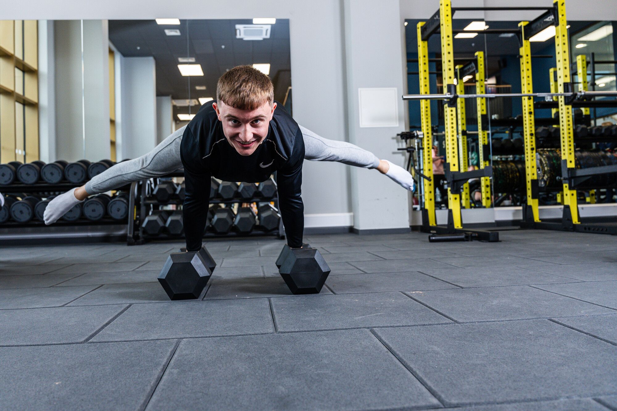 Male student using weights