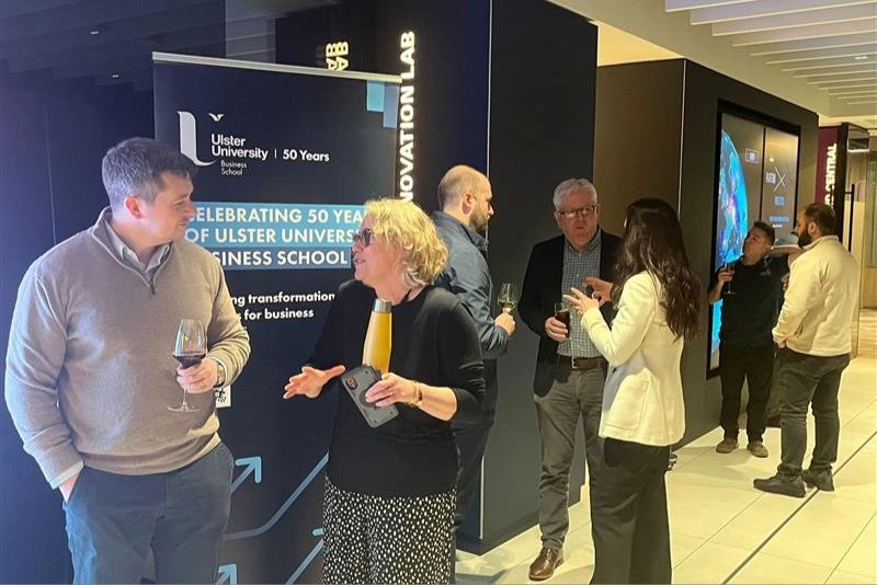 Group of attendees having a conversation at the \'Where AI Meets Leadership\' event