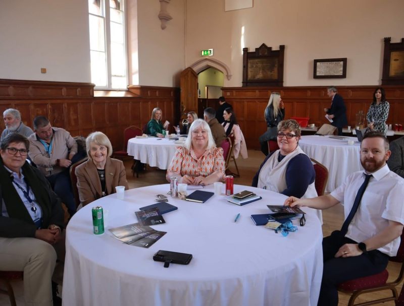 event attendees sitting at roundtable