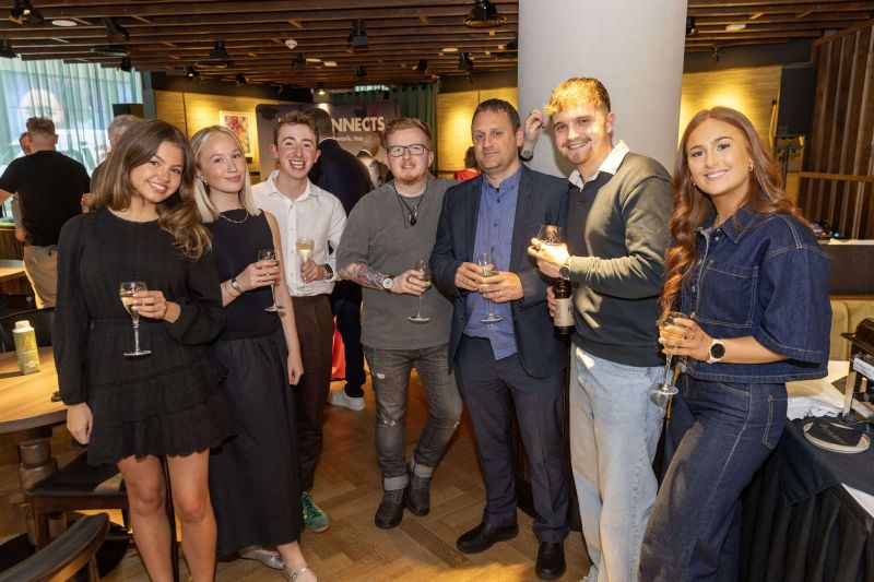 Group of guests standing at the Academy Restaurant Bar after the Ardmore Panel.
