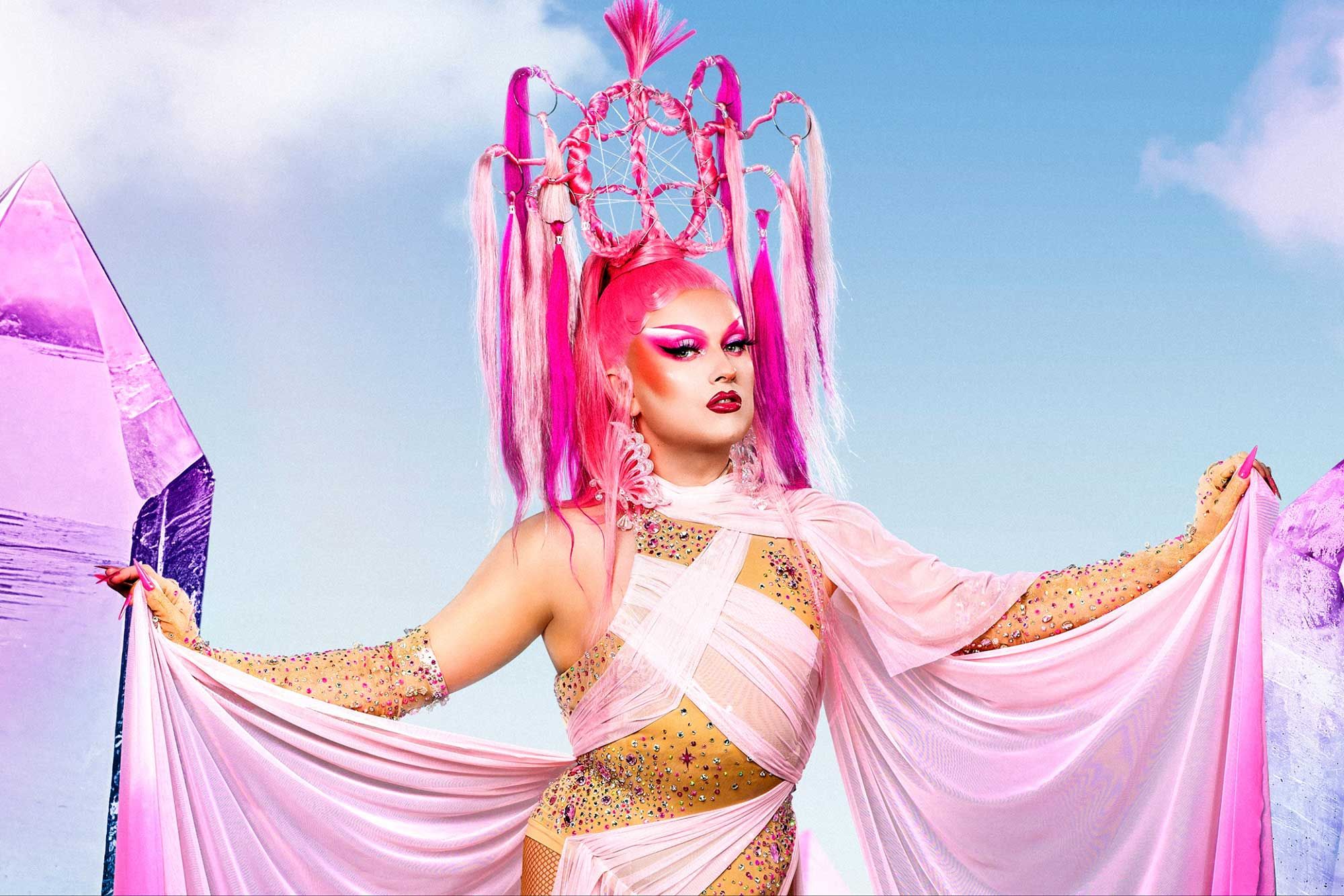 Ulster University student Evan Keating dressed in his drag persona Elle Vosque, wearing a pink dress and headpiece