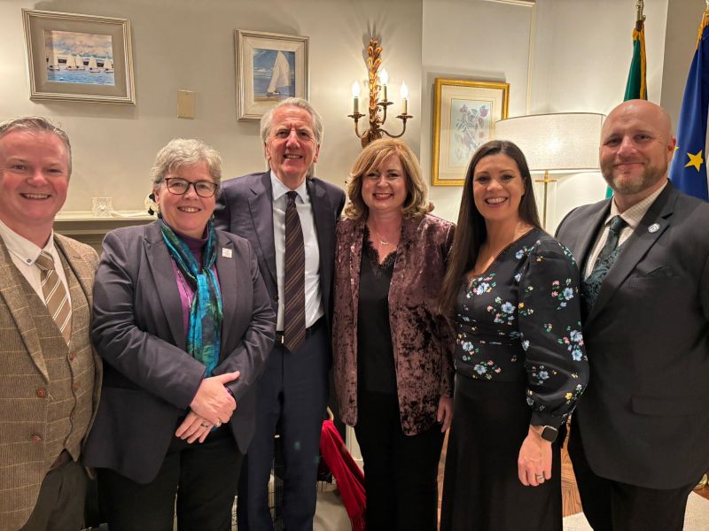 group of males and females gathered at a conference