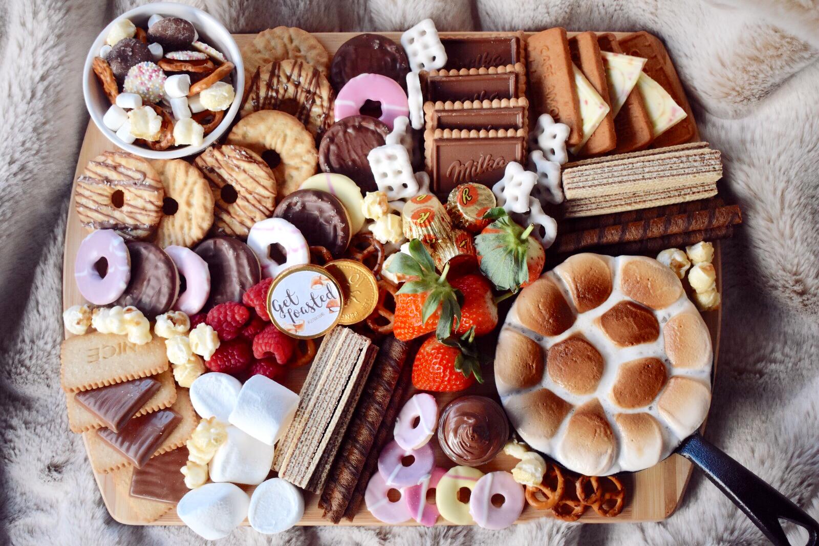 Full smore box including marshmallows, biscuits and chocolate.