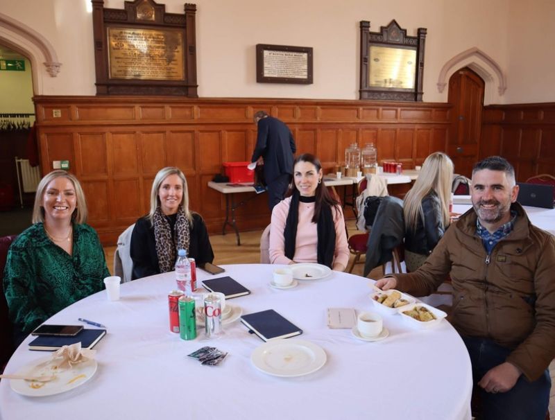 event attendees sitting at roundtable