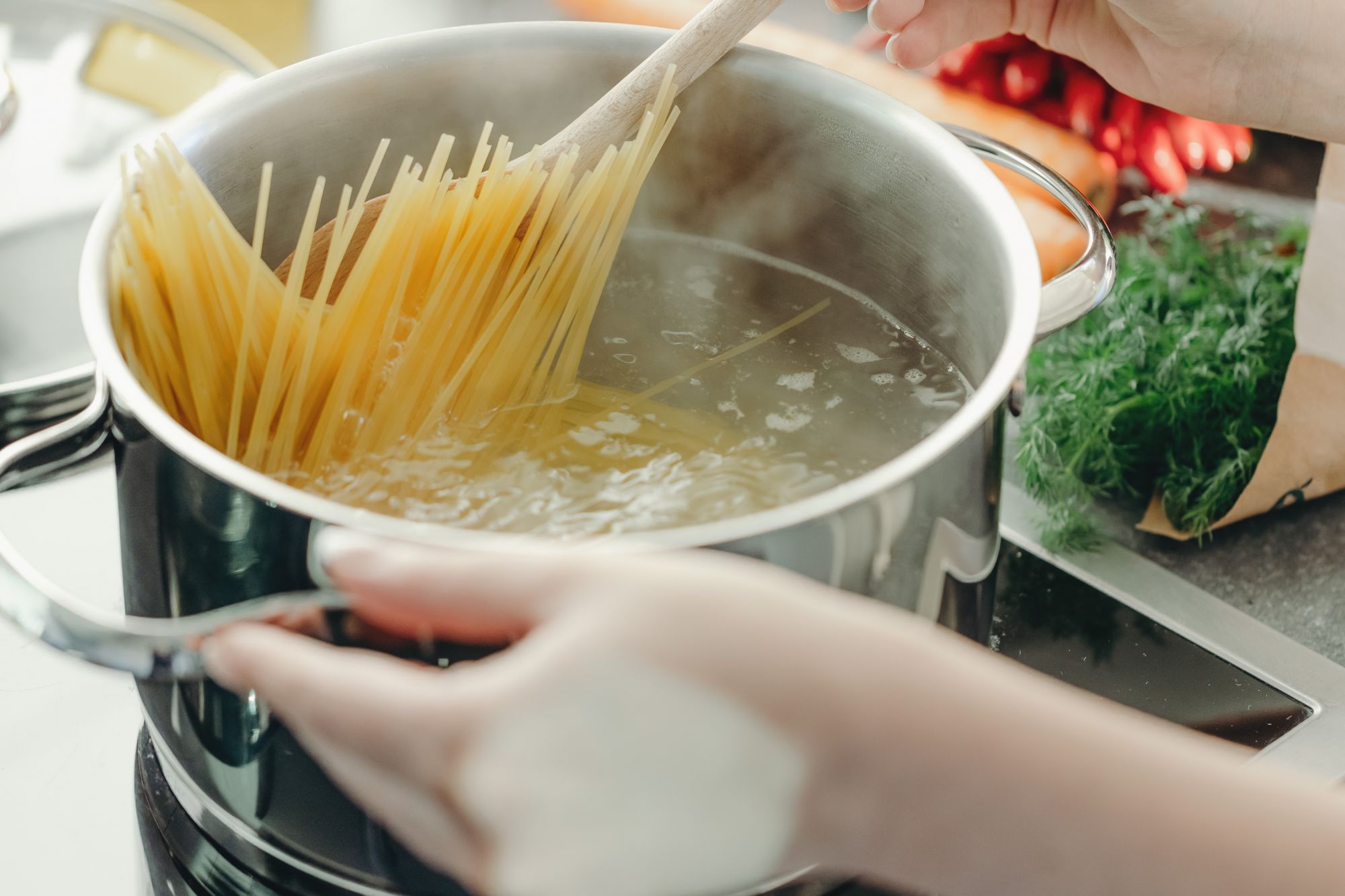 Spaghetti boiling in a pot