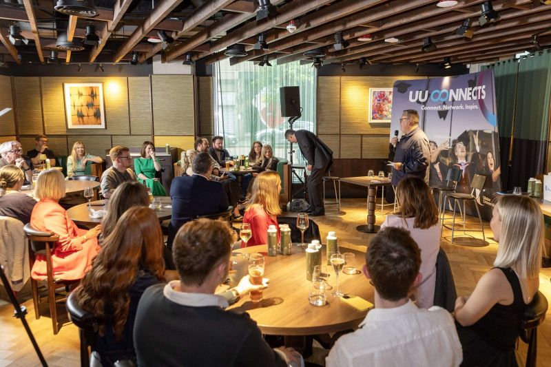 Landscape image of Ardmore event being held at Academy Restaurant with speaker John Keane on the microphone.