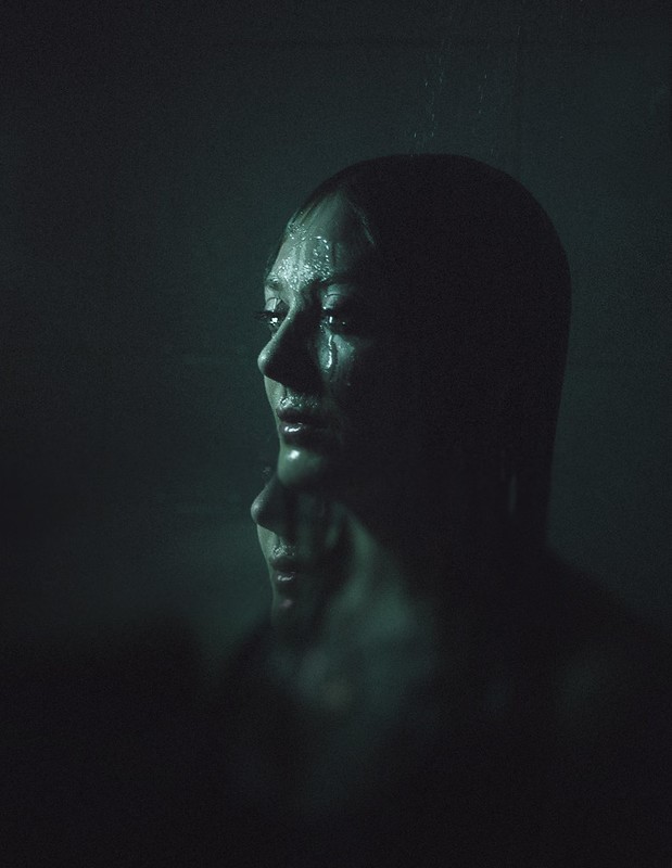 Woman with water dripping down from her head