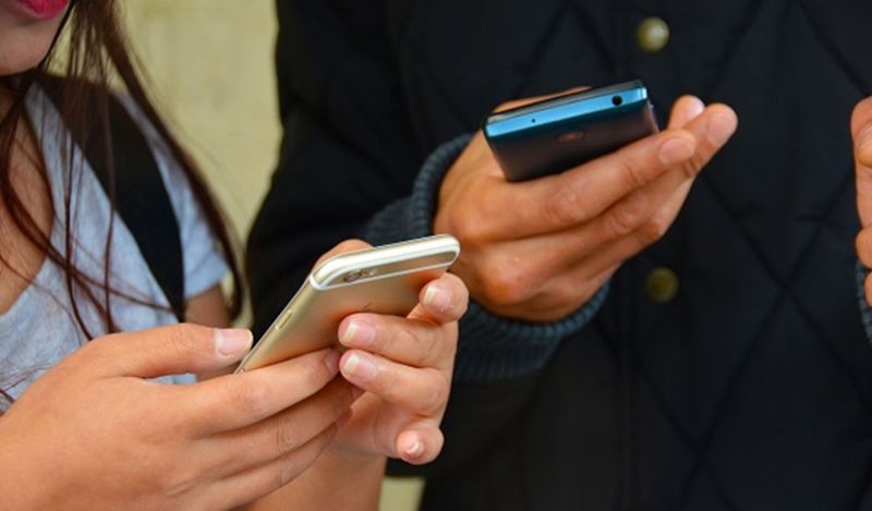 people on their phones
