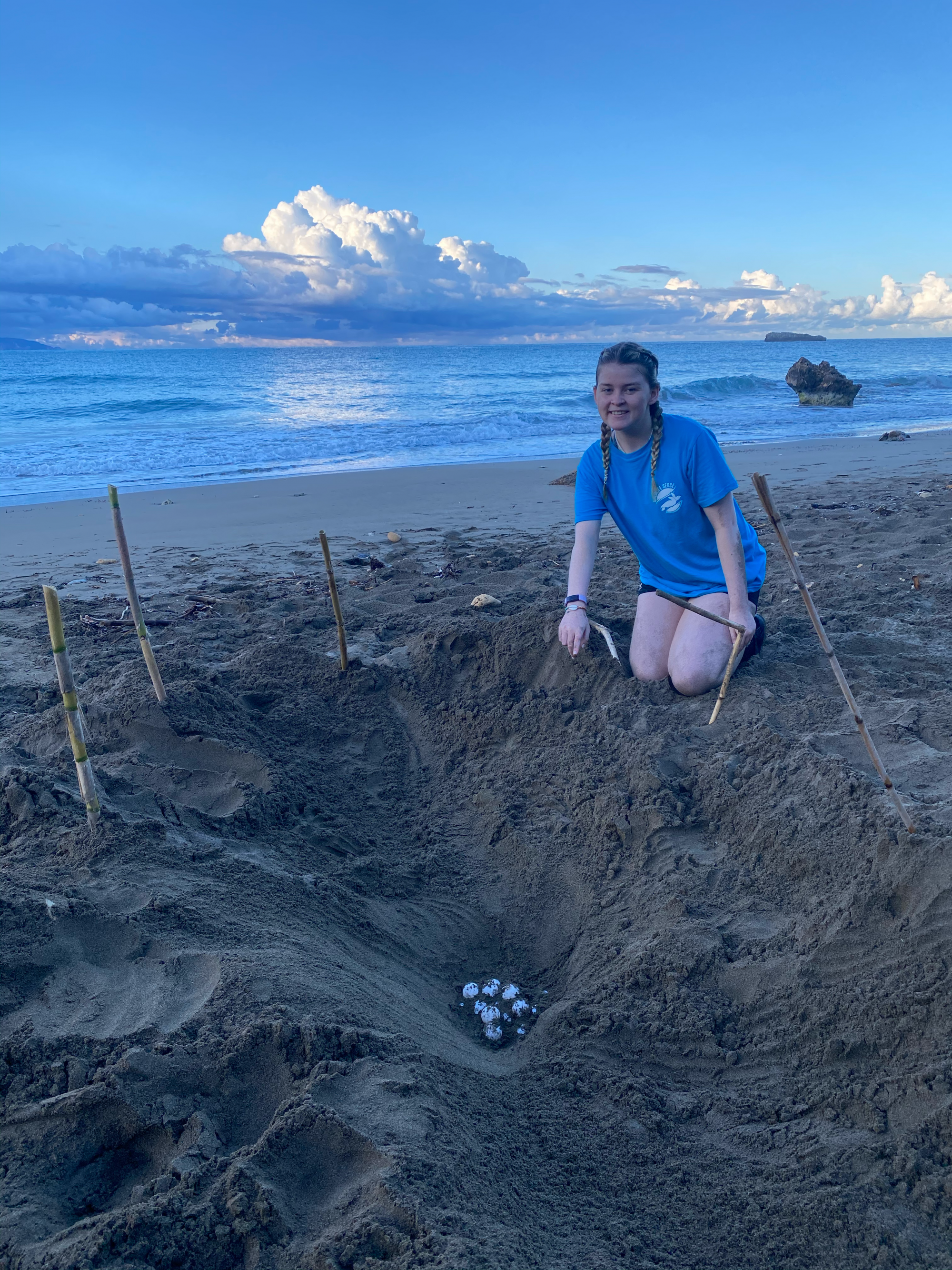 Kevina at the beach near turtle eggs