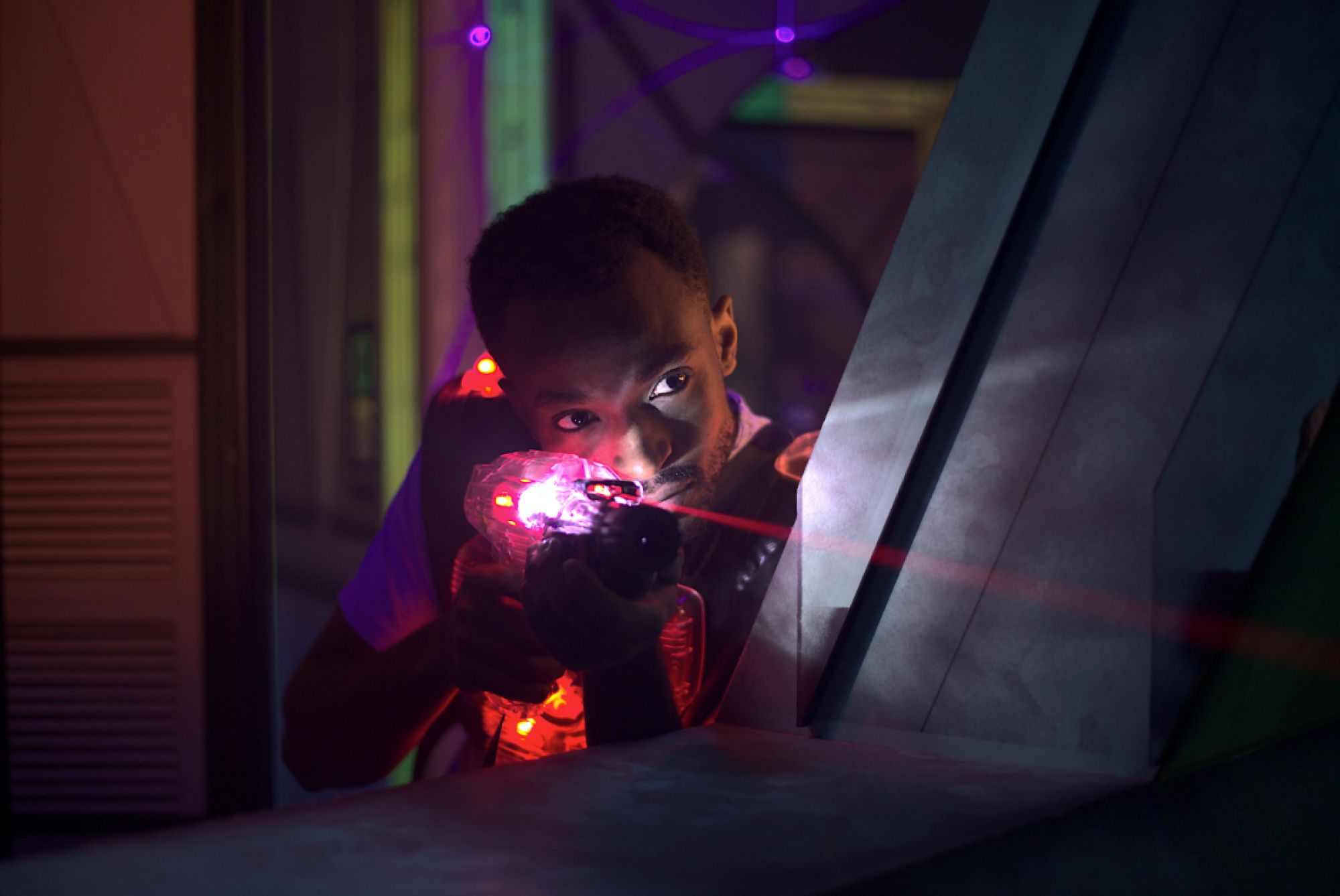 Stock image of man playing laser tag