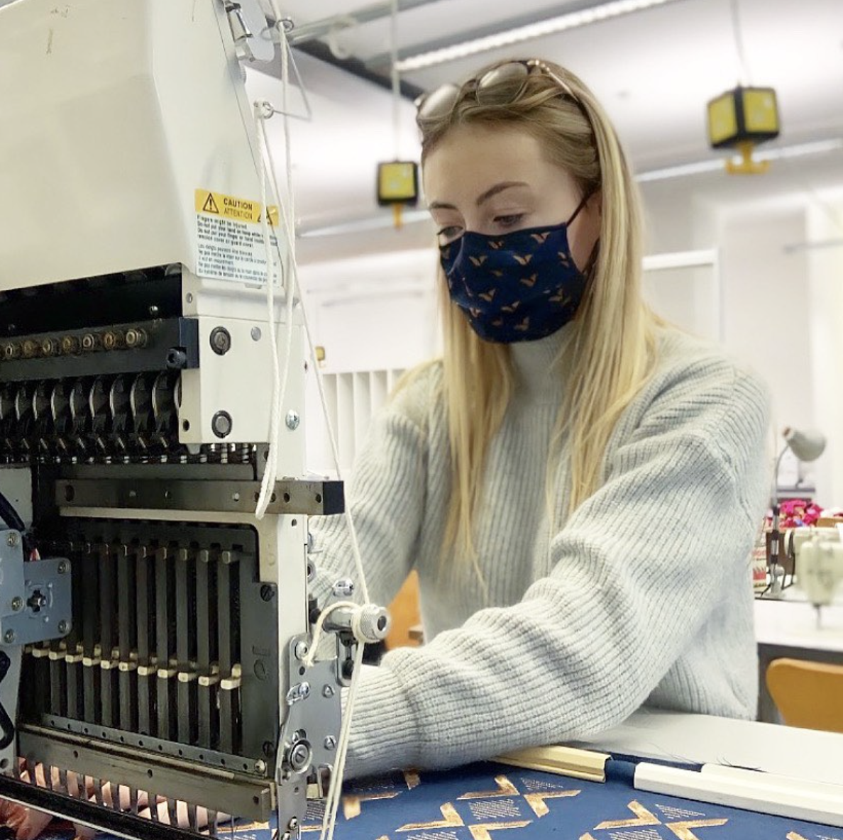 Robyn Elliot working on her sewing machine.