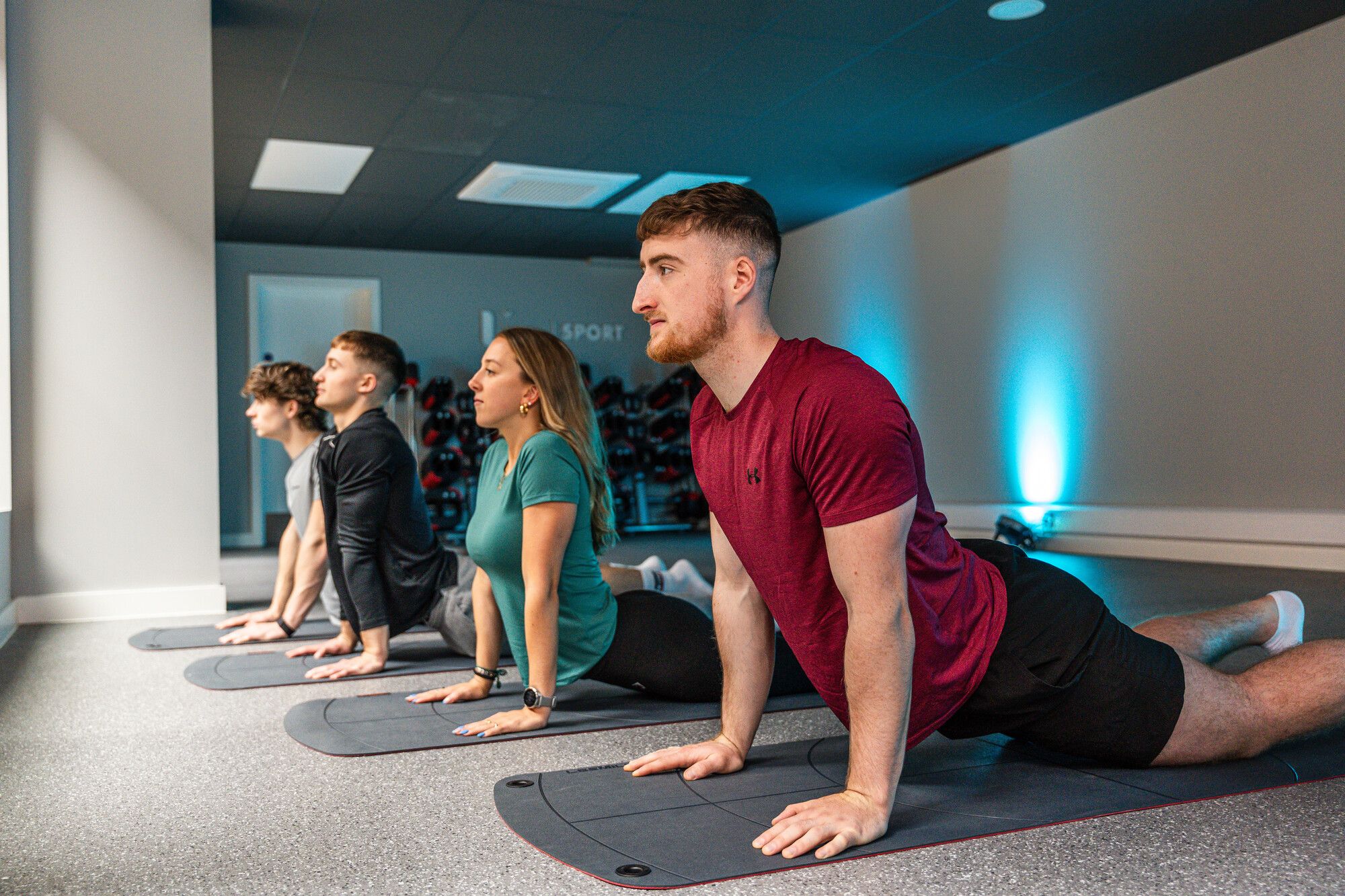 Four students taking part in yoga class