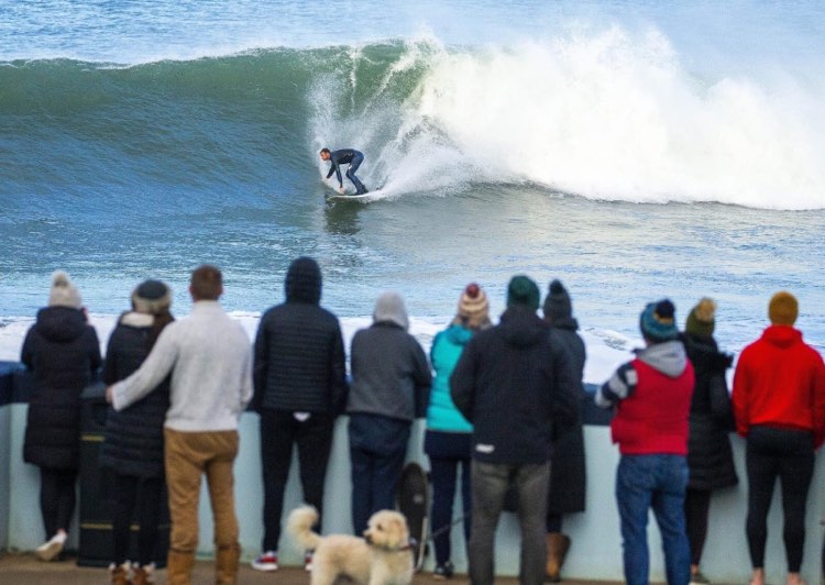 John surfing a wave.