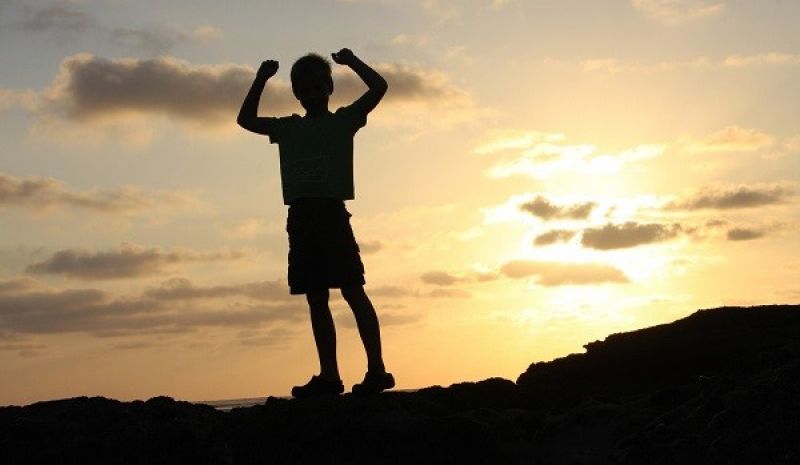silhouette of a boy