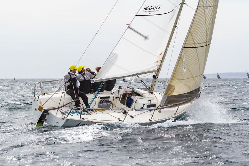 people sailing competitively