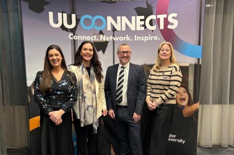 DARO Team standing in front of the UU Connects sign at the \'Where AI Meets Leadership\' event