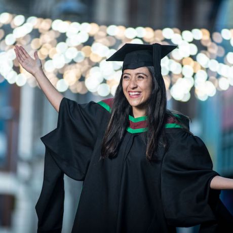 Inspirational international student graduates with distinction